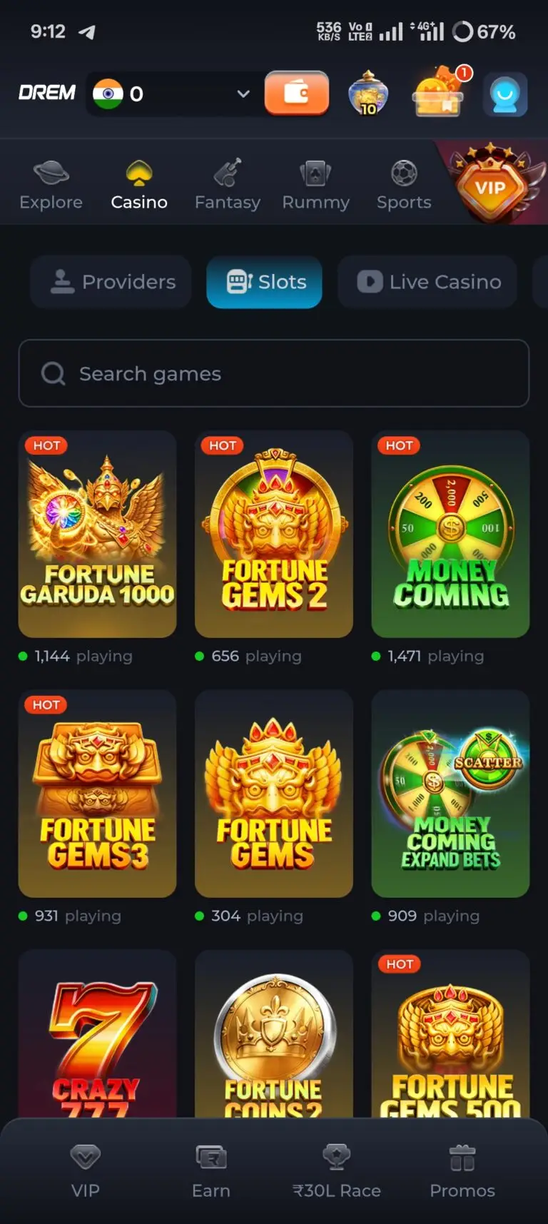DREM Game Online Casino Slots lobby featuring popular titles like Fortune Garuda 1000, Fortune Gems 2, Money Coming, and Crazy 777. The screen displays live player counts, a game search bar, and navigation to VIP, Earn, ₹30L Race, and Promos.