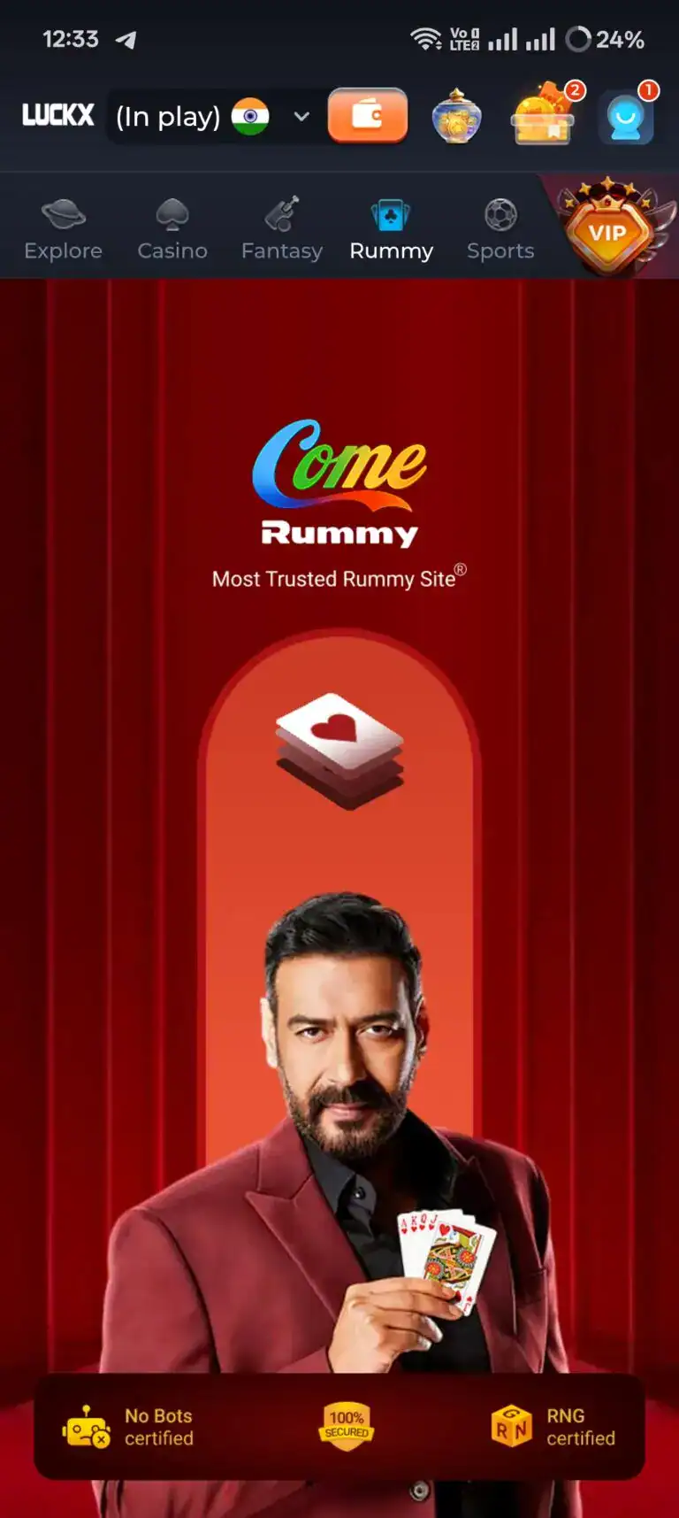 LUCKX Game Rummy lobby featuring Come Rummy with actor Ajay Devgn. The screen highlights trust badges including No Bots certified, 100% Secured, and RNG certified for a safe real-money LUCKX Game Download experience.