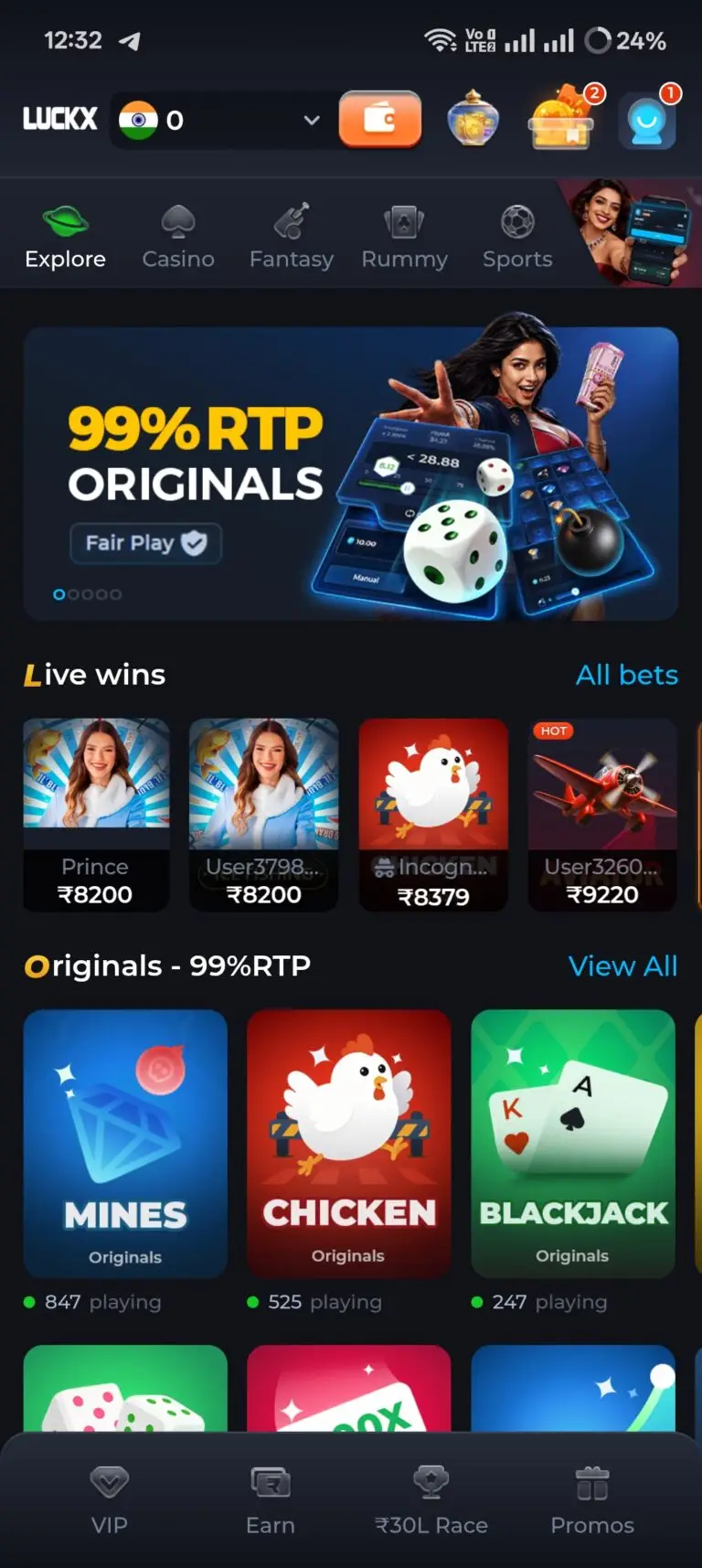 LUCKX Game homepage featuring a 99% RTP Originals banner with a Fair Play badge. The screen displays a Live Wins ticker showing real cashouts and an Originals section featuring Mines, Chicken, and Blackjack with active player counts.